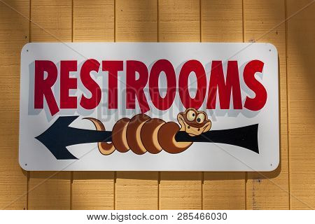 Rapid City, South Dakota - June 10, 2014: A Cute Sign With A Cartoon Character Snake Rapped Around A