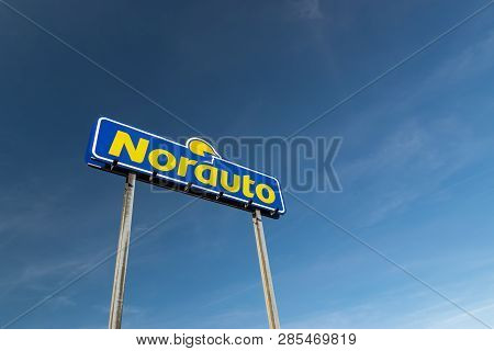 Roncq,france-february 20,2019: Norauto Brand Logo On A Blue Sky Background.norauto Is A French Based