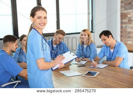 Medical Student With Groupmates In University Library