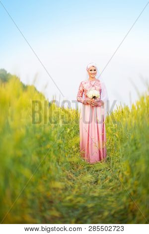 Muslim Bride Posing At A Celebration Ceremony.