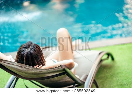 A Beauty Asian Woman Enjoying With Her Summer Vacation At Swimming Pool In Pattaya, Thailand.