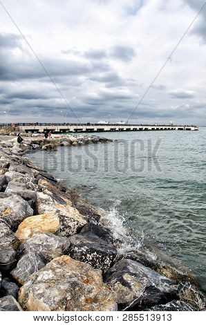 Dramatic Landscape On A Storm Sea In Iskenderun, Turkey With Stone Pier