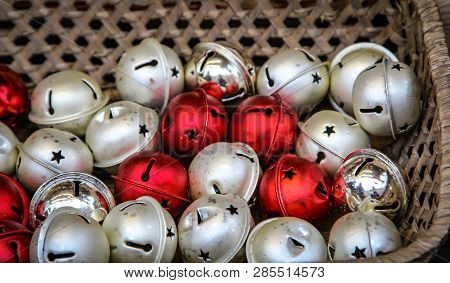 A Lot Of Christmas Bells In A Basket