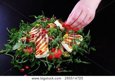 Salad With Grilled Halumi With Pomegranate And Arugula