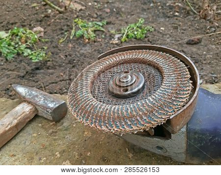 Electric Sander And A Hammer Close Up