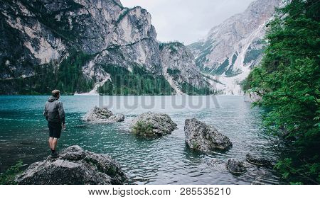 Hiker Enjoing Beautiful View Of Lago Di Braies Or Pragser Wildsee, Trentino Alto Adidge, Dolomites M