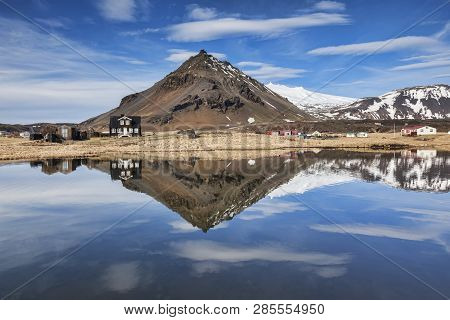The Mountain Stapafell Reflected In A Pool At Arnarstapi On The Snaefellsnes Peninsula, Iceland.