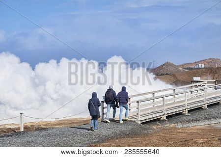 18 April 2018: Reykjanes Peninsula, Iceland - Tourists At Gunnuhver Hot Springs.