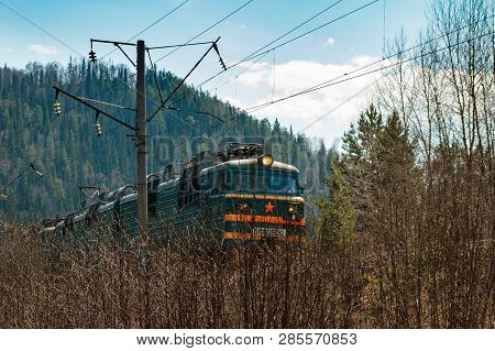 Chelyabinsk Area/russia - May 03 2014: Electric Train Rzhd On Mountain Forest Background In Springti
