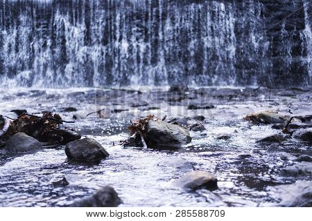 A Blurred Waterfall Background And Flowing Stream Nature Picture At Burr Pond Torrington, Connecticu
