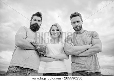 Strength In Unity. Woman And Men Look Confident Sky Background. Threesome Stand Confidently With Fol
