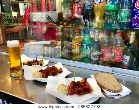 VIENNA, AUSTRIA - JULY 2018 : Sliced Vienna sausage served with mustard and bread on plate at Zum goldenen WÃ¼rstel sausage stand in Vienna, Austria on July 16, 2018.