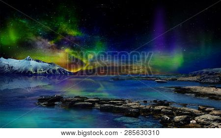Beautiful northern lights of the northern part of the planet. Magnificent views of the ocean and northern lights with rocks and stones. Beautiful sea water plays with colors and light