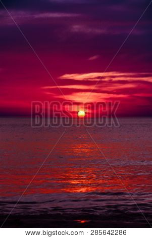 Blood Red And Dark Purple Sunset Of Sun Sets Over Horizon Adaman Sea Only Couds And Water