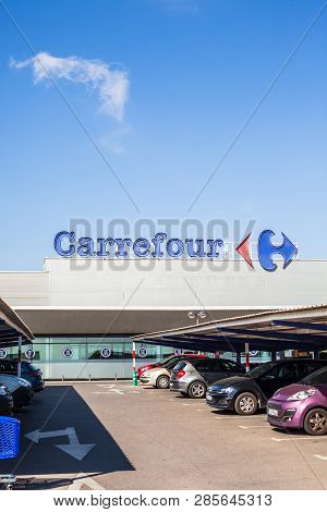 Orihuela, Spain - February 19, 2019: Carrefour Supermarket Chain Brand Logo At Its Building Located 