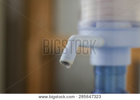A Drop Of Water On The Pump On A Light Background With Space For Text. Concept Drought And Crisis En