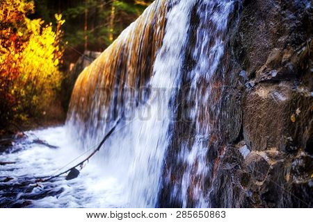 A Blurred Waterfall Background And Flowing Stream Nature Picture At Burr Pond Torrington, Connecticu