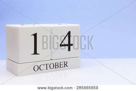 October 14st. Day 14 Of Month, Daily Calendar On White Table With Reflection, With Light Blue Backgr