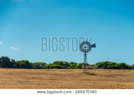 Old Rusty Windmill On Dry Farmland In Western Australia