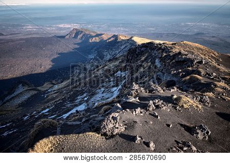 Schiena Dell'Asino is one of two ridge makes Bove Valley depression in winter Etna Park, Sicily