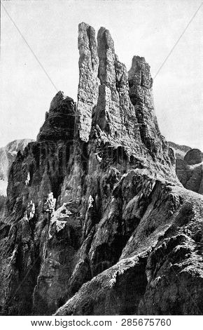 The Vajolet towers in the Rosengarten chain, vintage engraved illustration. From the Universe and Humanity, 1910.