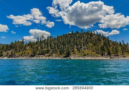 Mountains Seen On Shore Across The  Crystal Clear Turquoise Water, From The Boat On Lake Tahoe In Ca