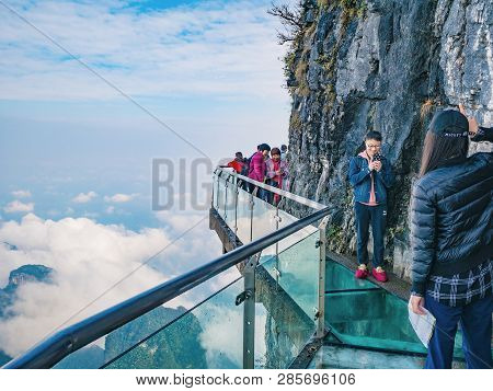 Zhangjiajie/china - 15 October 2018:unacquainted Tourists On Glass Cliff Walk In Tianmen Mountain At