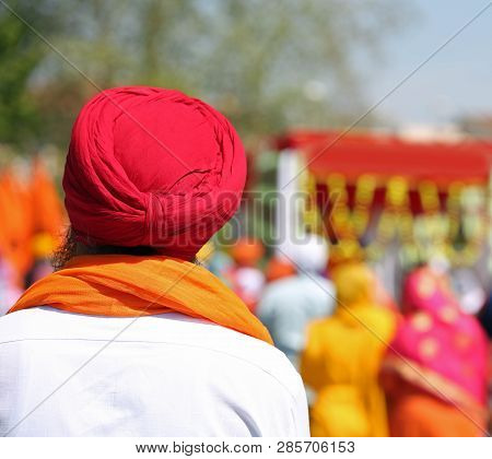 Sikh Man With Red Turban And White Shirt