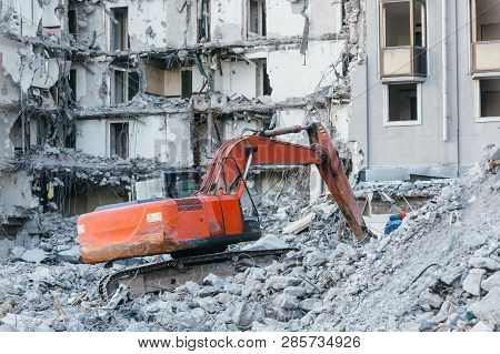 Cleaning Of Construction Debris With A Bucket Of An Excavator/ Building Demolition Excavator, Heavy 