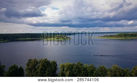 Blue Sky And Blue Lake In Summer. White Clouds Are Reflected In The Water. The Famous Lake Seliger. 