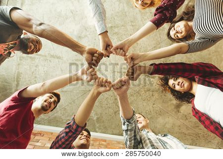 Group Of People Making Fist Bump. People Solidaruty Concept