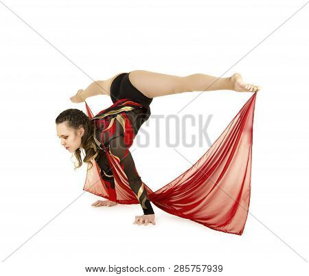 Flexible Equilibrist Performs Exercises On Acrobatic Walking Sticks.