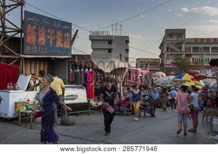 Turpan, China - August 10, 2012: People At A Street Market In The City Of Turpan, Xinjiang Region.