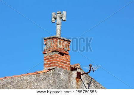 Family House Chimney With Concrete Top In Form Of Closed Concrete Pipe With Two Additional Pipes On 