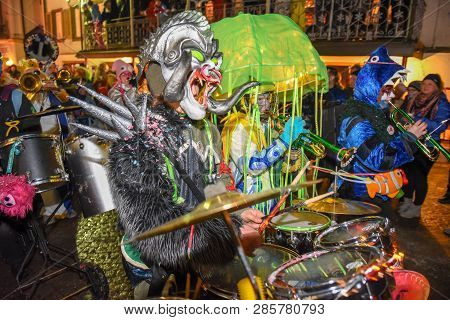 Participants In Costumes Perform A Street Procession At The Carnival