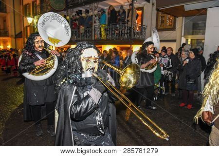 Participants In Costumes Perform A Street Procession At The Carnival