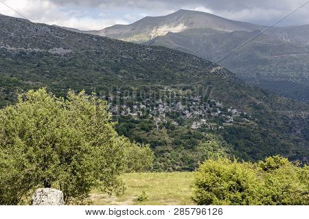 View Of The Traditional, Greek Village Kalarrytes Which Is On The Mountain Baros At An Altitude Of 1
