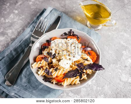 Tasty Italian Fusilli Pasta With Cherry, Mozarella Or Buratta Cheese And Fresh Basil. Dish With Past