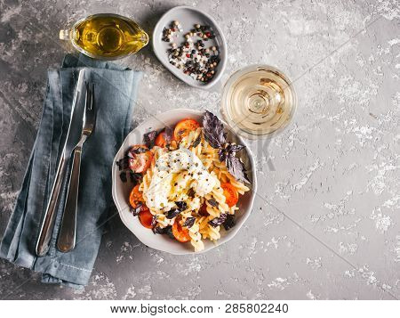 Tasty Italian Fusilli Pasta With Cherry, Mozarella Or Buratta Cheese And Fresh Basil. Dish With Past