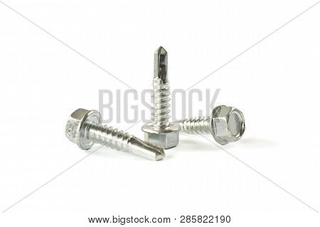 Closeup Self Drilling Screws For Roofing With A Drill And With Sealing Washer Isolated On White. Iso