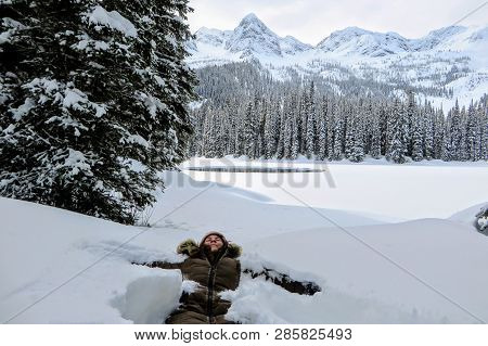 A Young Woman Having Fun Around Island Lake In Fernie, British Columbia, Canada.  The Majestic Winte