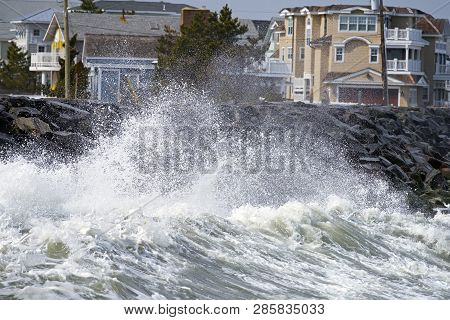 Large Storm Waves Crashing Against The Seawall