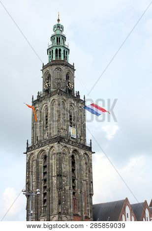 Martini Tower From The 15th Century And Dutch Flags In The City Of Groningen.the Netherlands