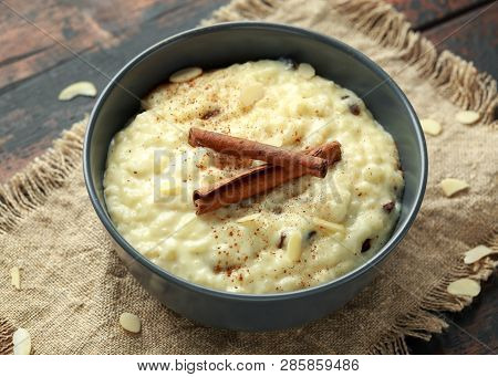 Classic Rice Pudding With Cinnamon And Almond Nuts. Healthy Breakfast