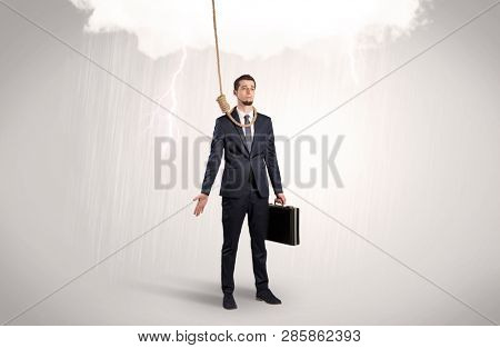 Young businessman trying to suicide with pointing hands concept