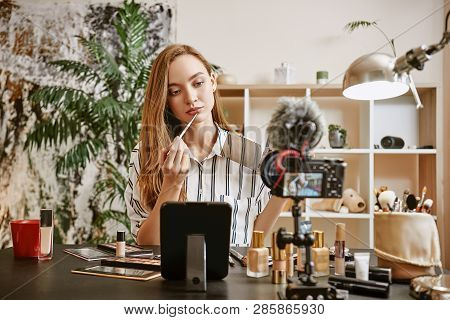 Trying A New Color. Young Female Blogger Trying A New Lipstick Color While Making New Video Tutorial