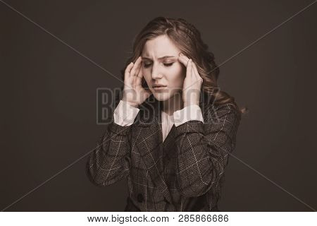 Health And Pain. Stressed Exhausted Young Woman Having Strong Tension Headache. Closeup Portrait Of 