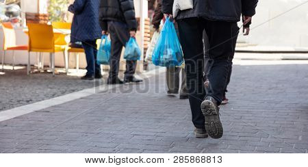 People Hoding Plastic Bags. Closeup View, Copy Space