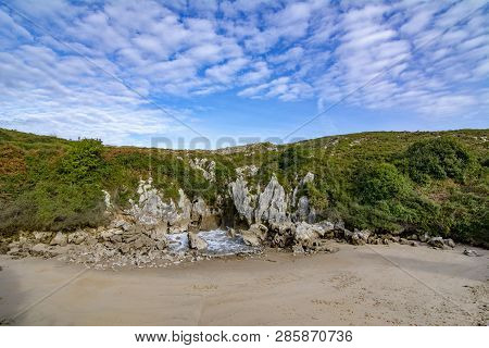 Beautiful Front Shot Of The Beach Of Gulpiyuri In The Council Of Llanes In Asturias, Spain