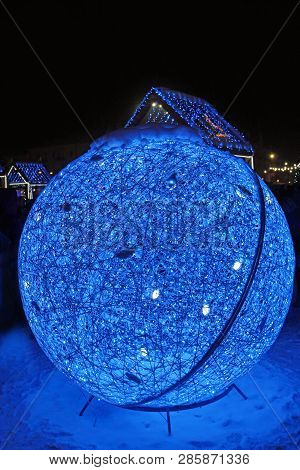 Big Blue Sphere From Garlands And Shiny Lights At New Year Featival